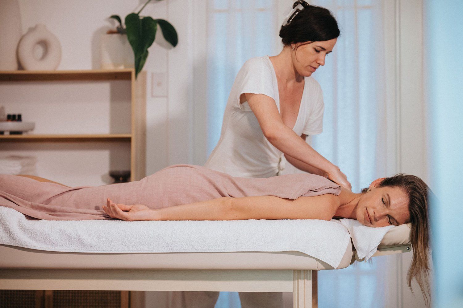 Massage Therapist with a client with Paloma Massage
